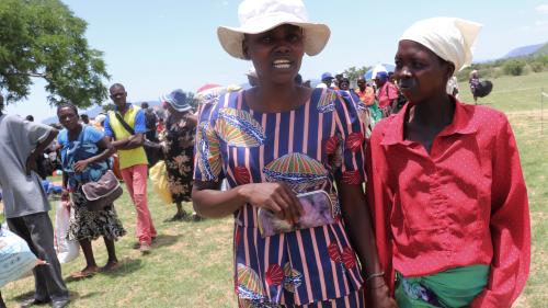 Emma (l) and Agnes (r) walk together are the food distribution point