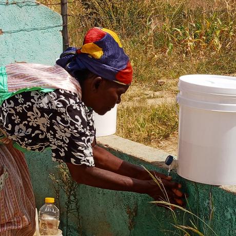 A woman washing her hands